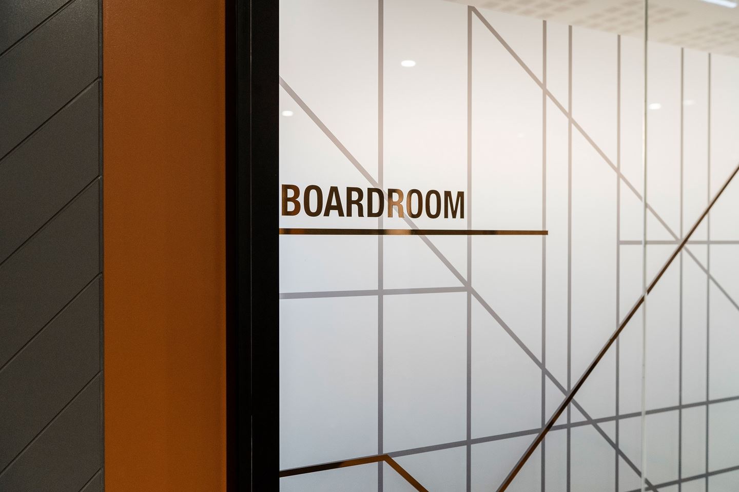 Close up of the CBH Head Office Boardroom door with bronze foil lettering on glass which reads 'Boardroom' 