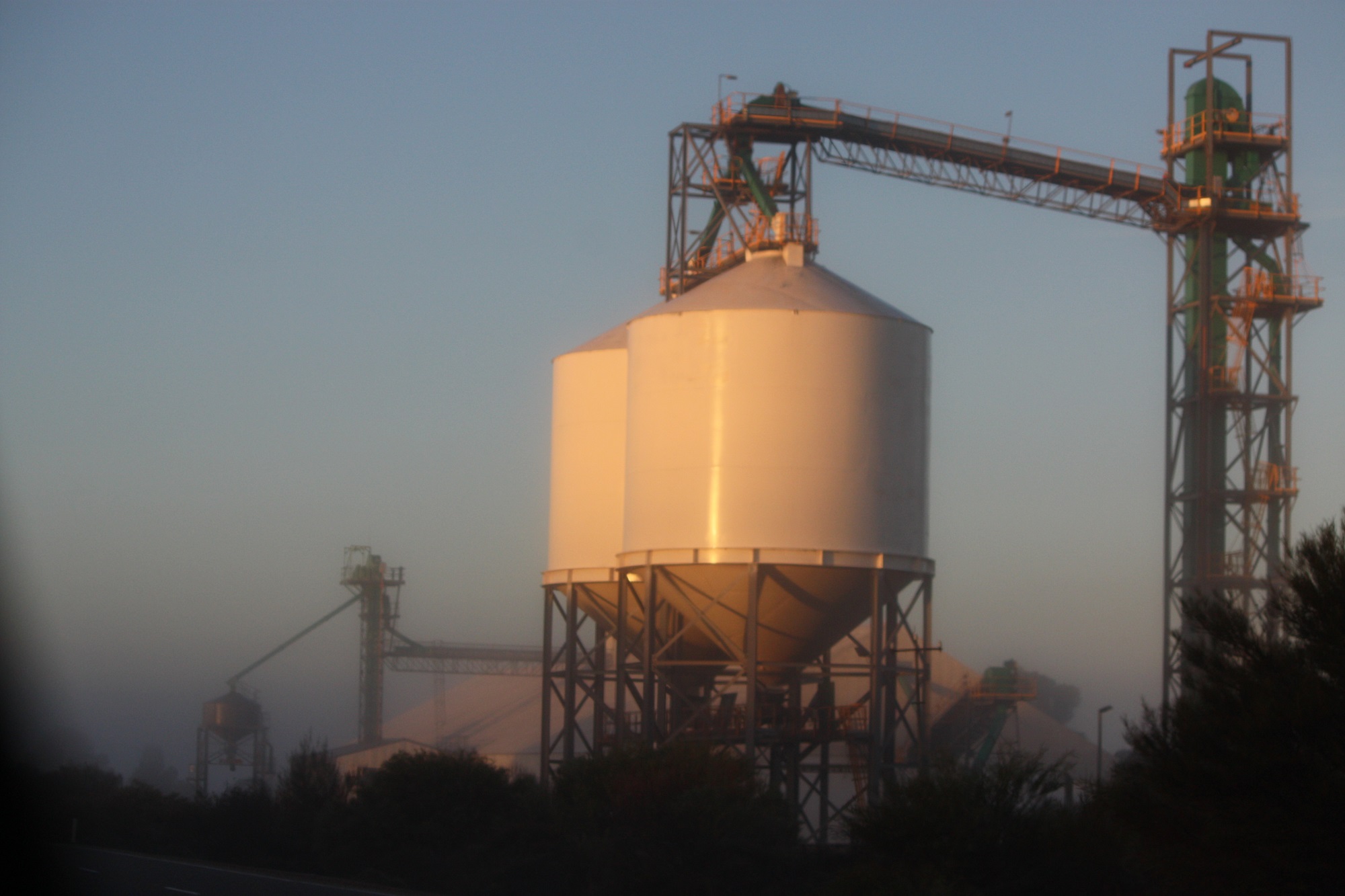Two silos at CBH receival site at dusk.