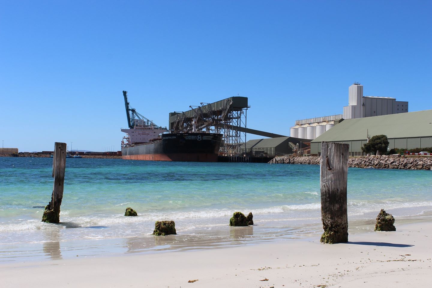 A ship berthed in clear blue waters at Esperance Terminal 