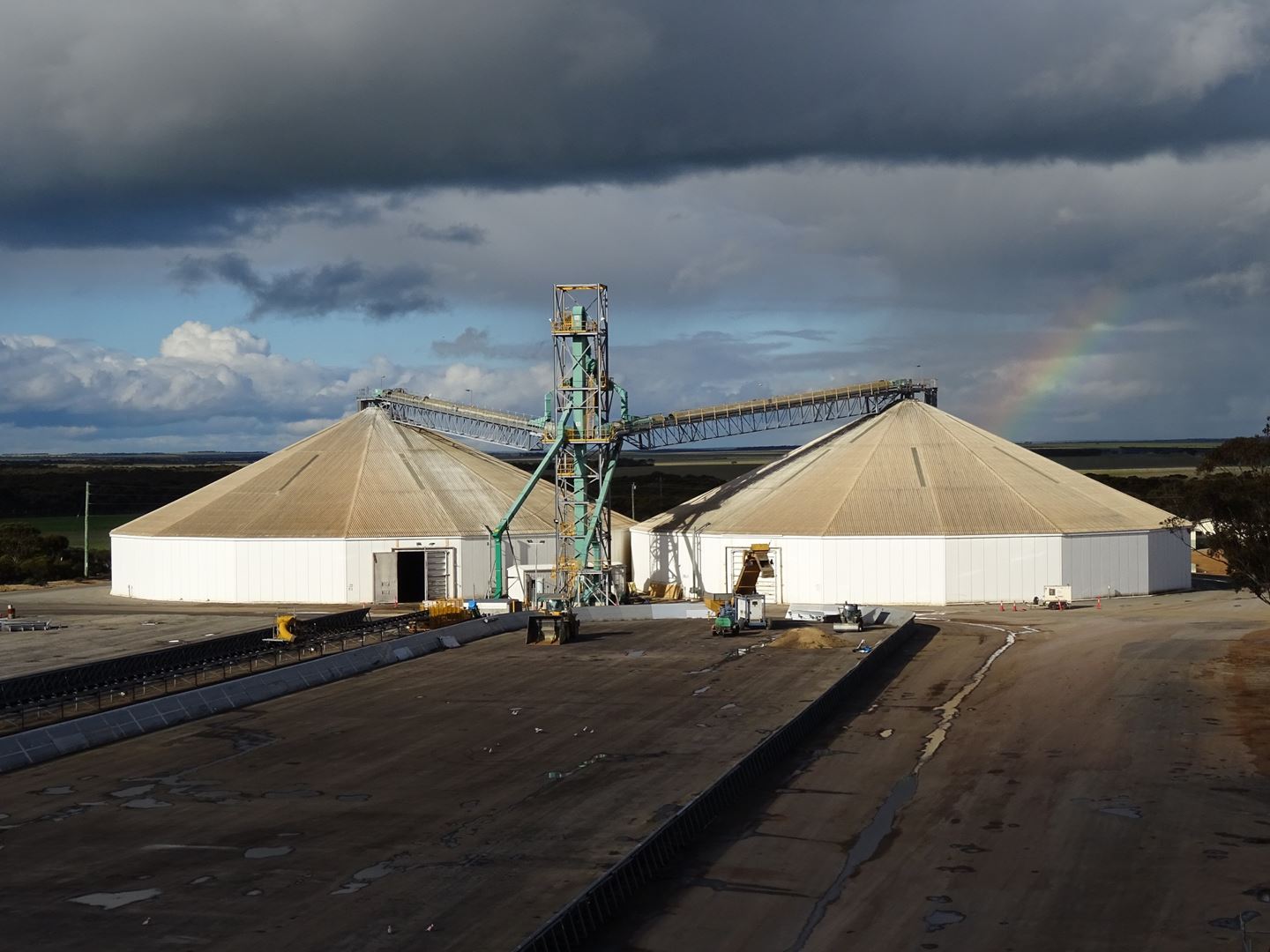 A rainbow over the roof of a circular storage shed at CBH Mount Madden site